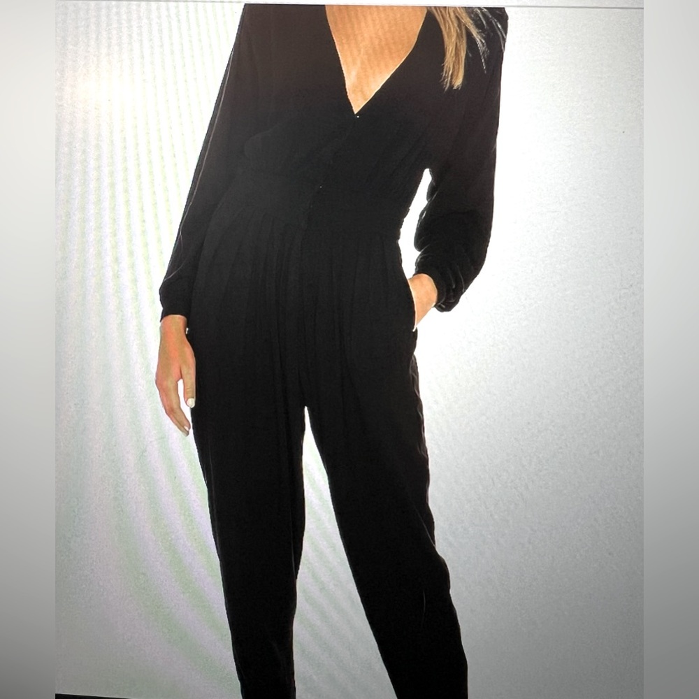 Indah one piece black pant jumper. Cute & easy wear